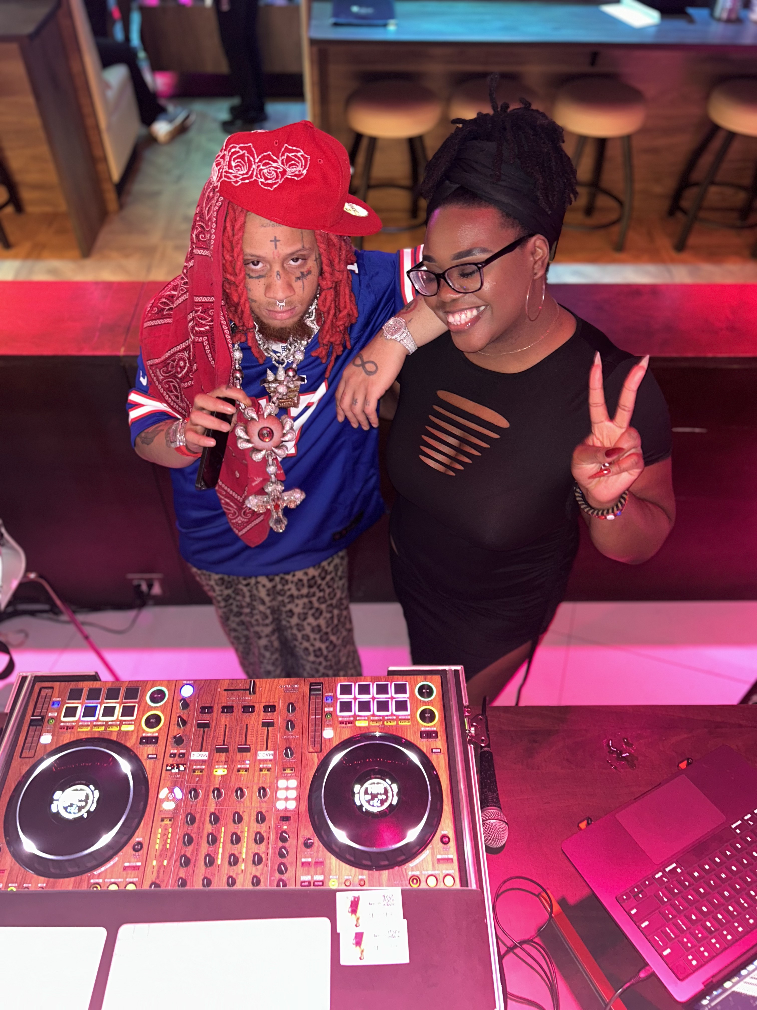 DJ Sam I Am in the booth with a recording artist